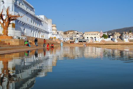 Jaipur Pink City architecture with Amber Fort and Jantar Mantar, and Pushkar Lake with sacred ghats and Brahma Temple in Rajasthan. Experience the best of Jaipur and Pushkar with The Trip Flix's tour package.